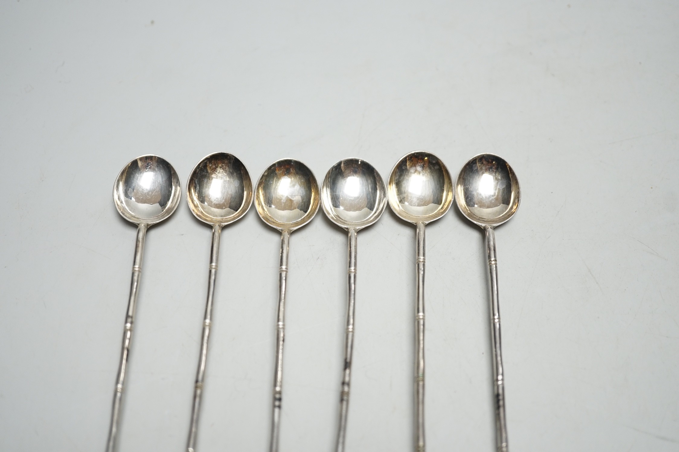 A set of six Chinese white metal and jade set iced tea spoons, by Wai Kee, 19cm.